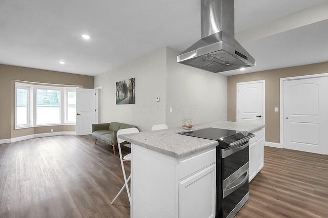 443 E Farming St, Marion, OH 43302 - kitchen featuring island exhaust hood, electric stove, dark wood-style flooring, a kitchen island, and baseboards