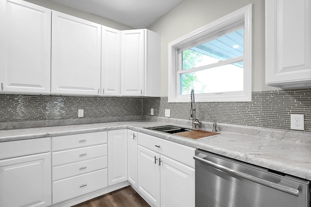 443 E Farming St, Marion, OH 43302 - kitchen with stainless steel dishwasher, a sink, white cabinets, tasteful backsplash, and dark wood-style floors
