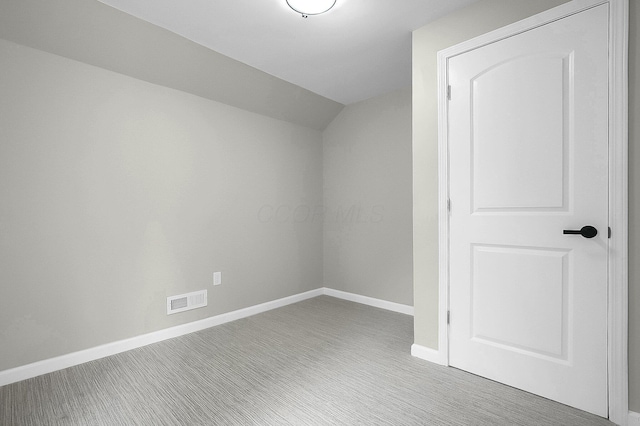 443 E Farming St, Marion, OH 43302 - bonus room with baseboards, vaulted ceiling, and carpet