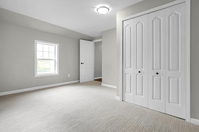 443 E Farming St, Marion, OH 43302 - unfurnished bedroom with a closet, carpet, and baseboards