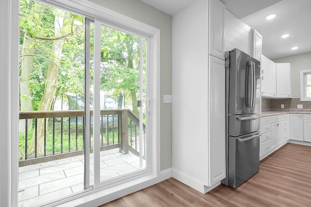 443 E Farming St, Marion, OH 43302 - kitchen with freestanding refrigerator, plenty of natural light, white cabinetry, wood finished floors, and recessed lighting