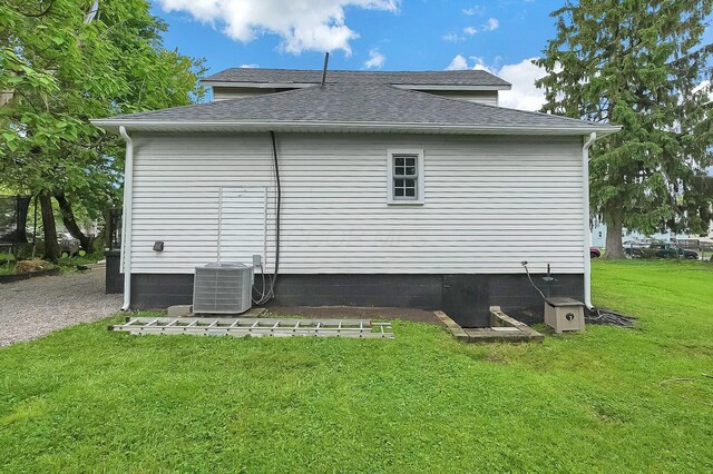443 E Farming St, Marion, OH 43302 - view of home's exterior with a shingled roof, a yard, and central air condition unit