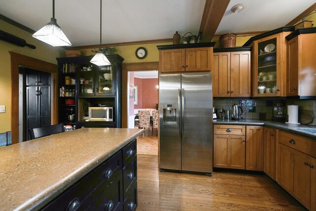 1452 W Cook Rd, Mansfield, OH 44906 - kitchen with appliances with stainless steel finishes, tasteful backsplash, wood finished floors, and glass insert cabinets