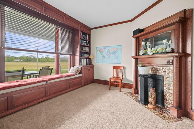 1452 W Cook Rd, Mansfield, OH 44906 - living area featuring carpet flooring, ornamental molding, baseboards, and a fireplace with flush hearth