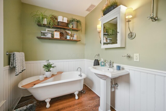1452 W Cook Rd, Mansfield, OH 44906 - bathroom with wood finished floors, wainscoting, and a freestanding bath