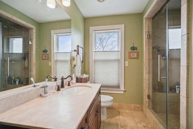 1452 W Cook Rd, Mansfield, OH 44906 - bathroom with a stall shower, tile patterned flooring, vanity, and toilet