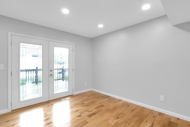 5744 Burcale Dr, Galloway, OH 43119 - doorway to outside featuring french doors, baseboards, light wood finished floors, and recessed lighting