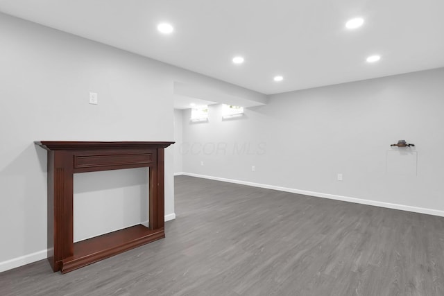 5744 Burcale Dr, Galloway, OH 43119 - finished below grade area with dark wood-style flooring, baseboards, and recessed lighting
