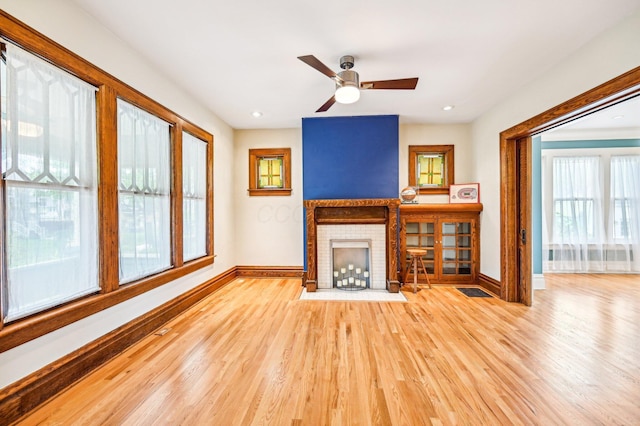 116 E Tulane Rd, Columbus, OH 43202 - unfurnished living room featuring baseboards, a fireplace, wood finished floors, ceiling fan, and recessed lighting
