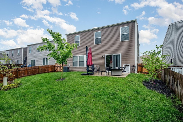 rear view of property with a patio area and central air condition unit