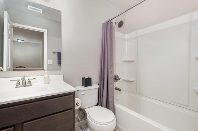 full bath with toilet, vanity, and shower / bath combo