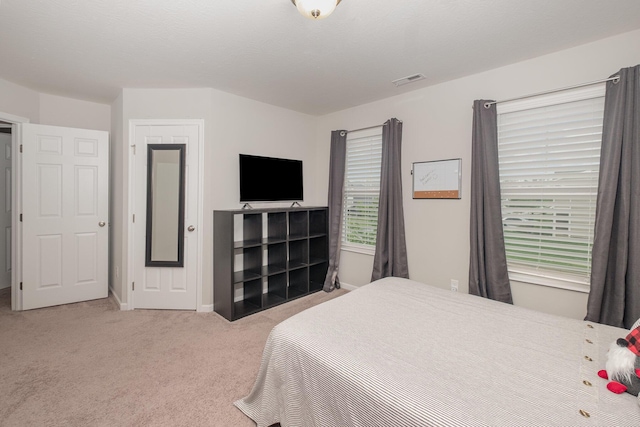 bedroom with carpet and baseboards