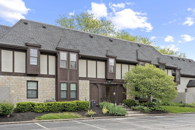 4811 Olentangy River Rd Unit F, Columbus, OH 43214 - view of building exterior featuring uncovered parking and central AC unit