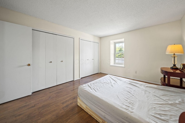 4811 Olentangy River Rd Unit F, Columbus, OH 43214 - bedroom with multiple closets, wood finished floors, and a textured ceiling