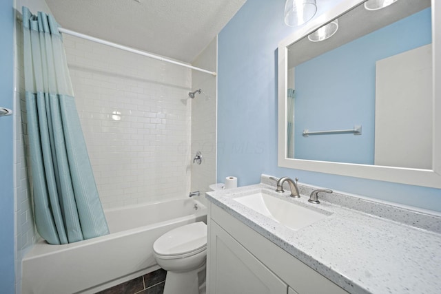 4811 Olentangy River Rd Unit F, Columbus, OH 43214 - full bathroom featuring toilet, shower / bath combination with curtain, vanity, a textured ceiling, and tile patterned flooring