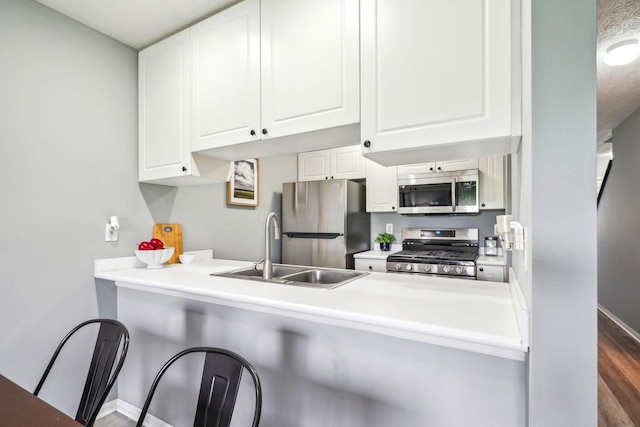 5176 Lodi Dr Unit 26B, Canal Winchester, OH 43110 - kitchen featuring stainless steel appliances, a sink, white cabinets, and baseboards