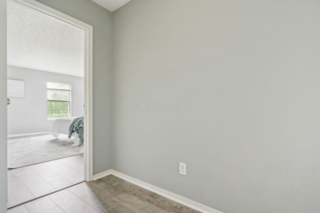 5176 Lodi Dr Unit 26B, Canal Winchester, OH 43110 - spare room with baseboards and a textured ceiling