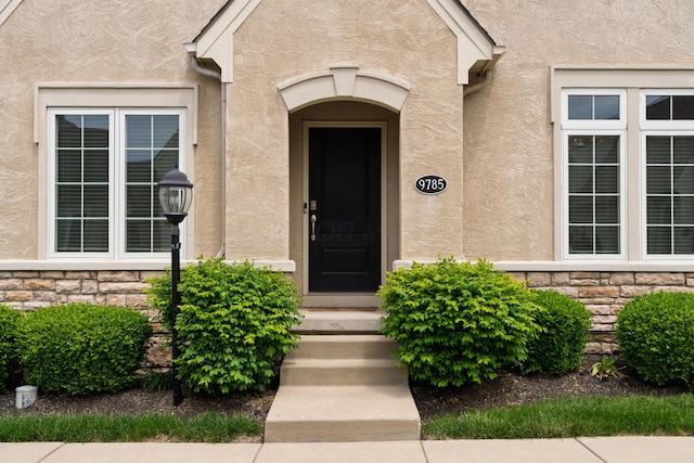 9785 Kingston Cir, Powell, OH 43065 - property entrance with stone siding and stucco siding