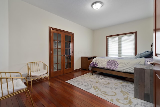9785 Kingston Cir, Powell, OH 43065 - bedroom featuring french doors and dark wood-style flooring