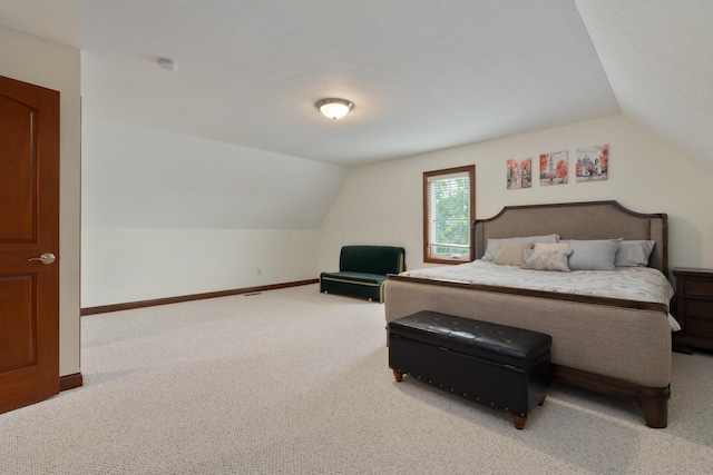 9785 Kingston Cir, Powell, OH 43065 - bedroom featuring lofted ceiling, carpet flooring, and baseboards