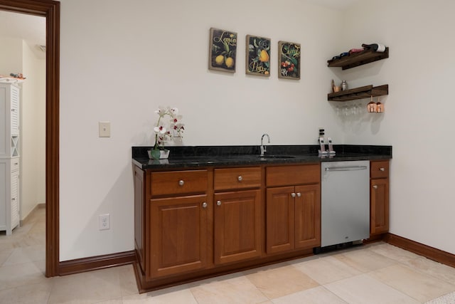 9785 Kingston Cir, Powell, OH 43065 - indoor wet bar with stainless steel dishwasher, baseboards, and light tile patterned flooring