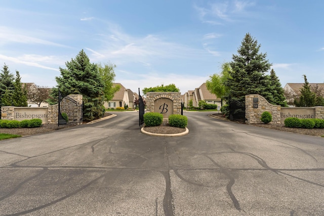 9785 Kingston Cir, Powell, OH 43065 - view of asphalt road featuring a gated entry and a residential view