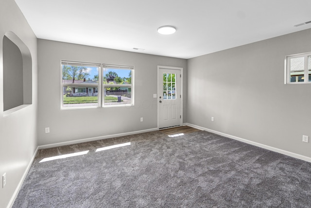 3441 Homestead Dr, Columbus, OH 43224 - spare room featuring carpet floors, baseboards, and healthy amount of natural light