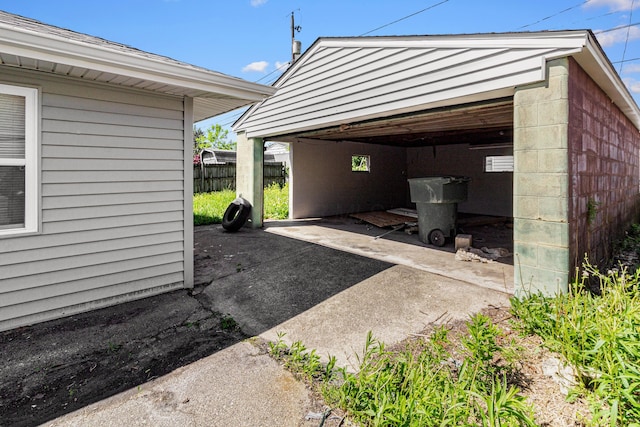 3441 Homestead Dr, Columbus, OH 43224 - view of parking / parking lot with fence and a detached garage