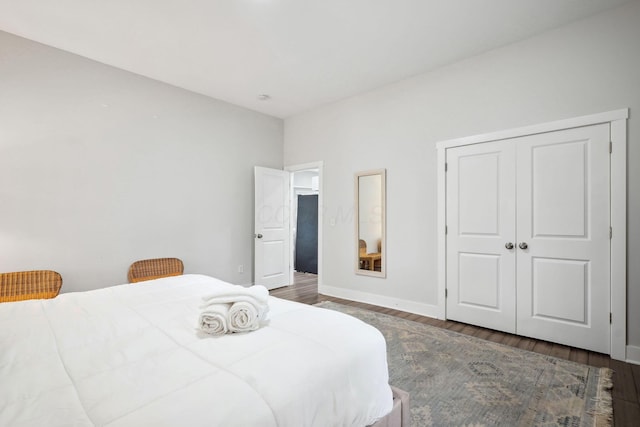 2230 N 4th St, Columbus, OH 43201 - bedroom featuring wood finished floors, baseboards, and a closet