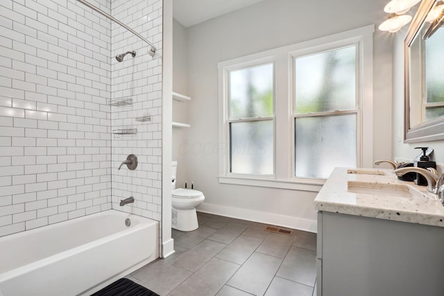 2230 N 4th St, Columbus, OH 43201 - bathroom with toilet, tile patterned floors, baseboards, vanity, and shower / bath combination