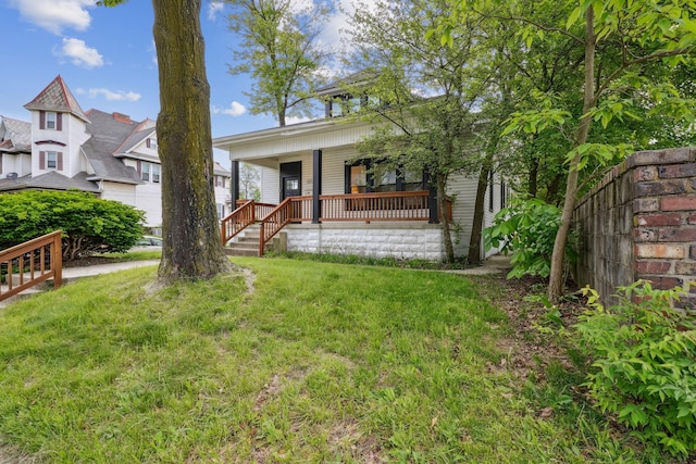 2230 N 4th St, Columbus, OH 43201 - view of front facade with a porch and a front yard