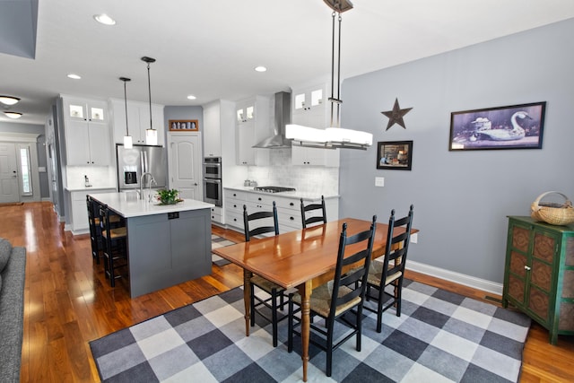 3687 Foresta Grand Dr, Powell, OH 43065 - dining room with dark wood-style flooring and recessed lighting