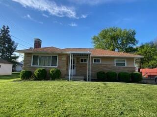 1616 Sale Rd, Columbus, OH 43224 - view of front of house featuring a front lawn and a chimney