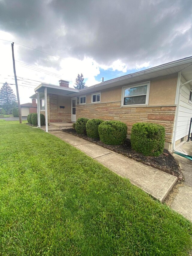 1616 Sale Rd, Columbus, OH 43224 - rear view of property featuring a lawn