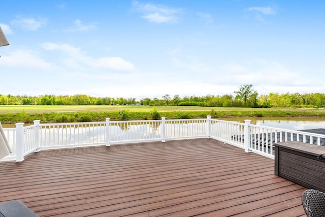 wooden terrace with a water view
