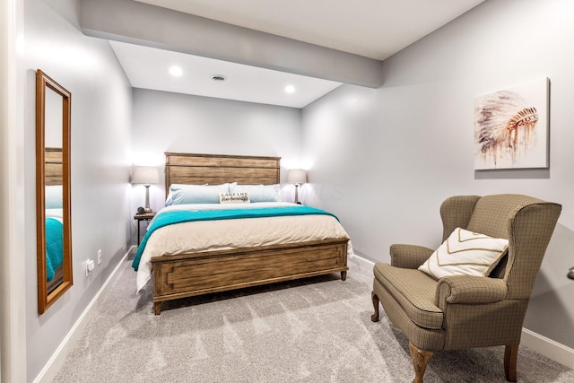 carpeted bedroom featuring baseboards and recessed lighting
