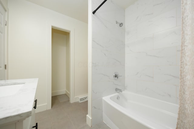 full bathroom with shower / bath combination, vanity, tile patterned floors, and baseboards