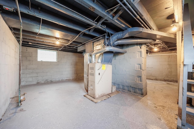 below grade area featuring heating unit