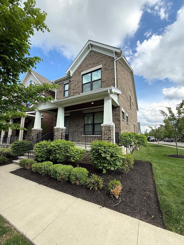959 Hudson Xing, Columbus, OH 43212 - craftsman-style house with brick siding, a porch, and a front yard