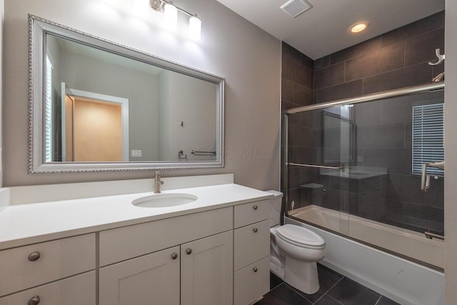 959 Hudson Xing, Columbus, OH 43212 - full bath featuring vanity, tile patterned floors, toilet, bath / shower combo with glass door, and recessed lighting