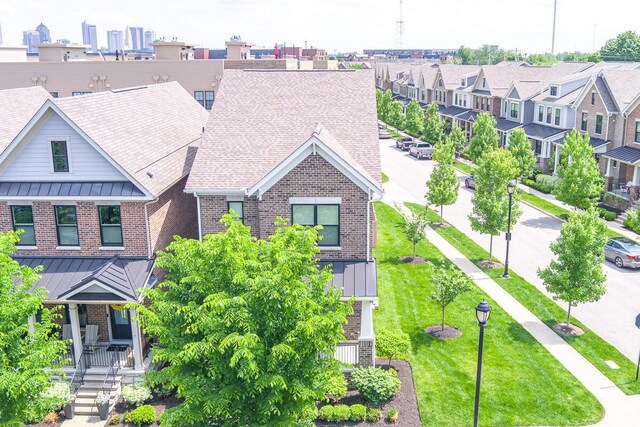959 Hudson Xing, Columbus, OH 43212 - view of front facade with brick siding, a residential view, and a standing seam roof