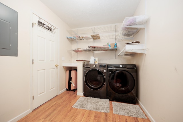 4618 Parrau Dr Unit 72B, Columbus, OH 43228 - clothes washing area with separate washer and dryer, wood finished floors, electric panel, and baseboards