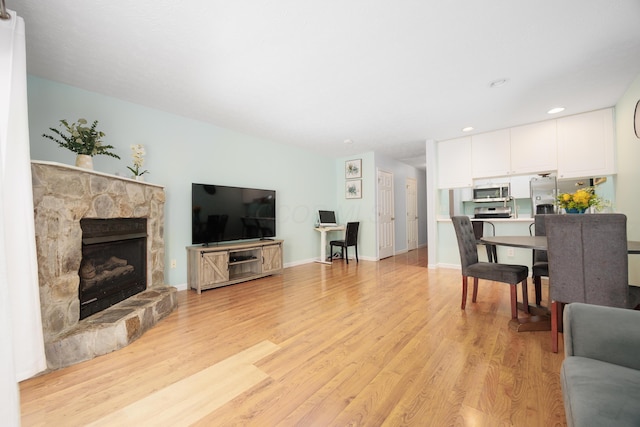 4618 Parrau Dr Unit 72B, Columbus, OH 43228 - living room with light wood-style floors, a fireplace, and recessed lighting