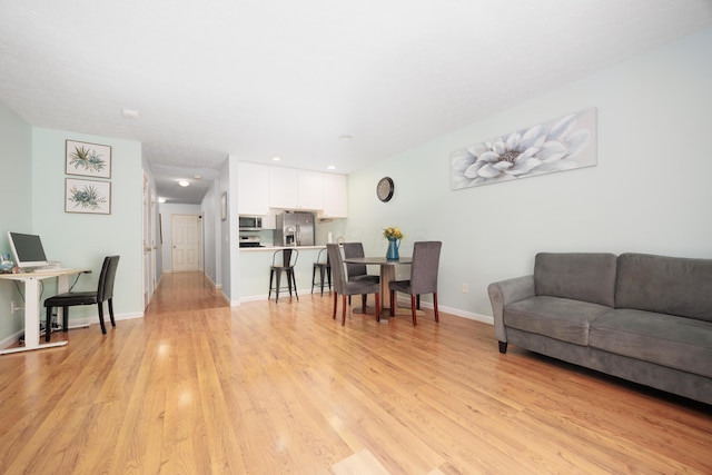 4618 Parrau Dr Unit 72B, Columbus, OH 43228 - living room with light wood-type flooring, baseboards, an office area, and recessed lighting