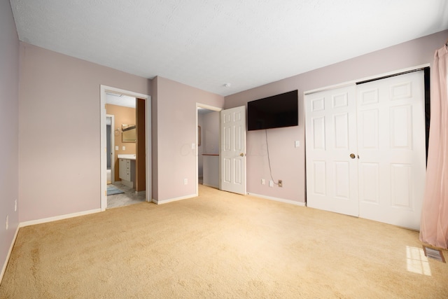 4618 Parrau Dr Unit 72B, Columbus, OH 43228 - unfurnished bedroom with carpet flooring, baseboards, and ensuite bath