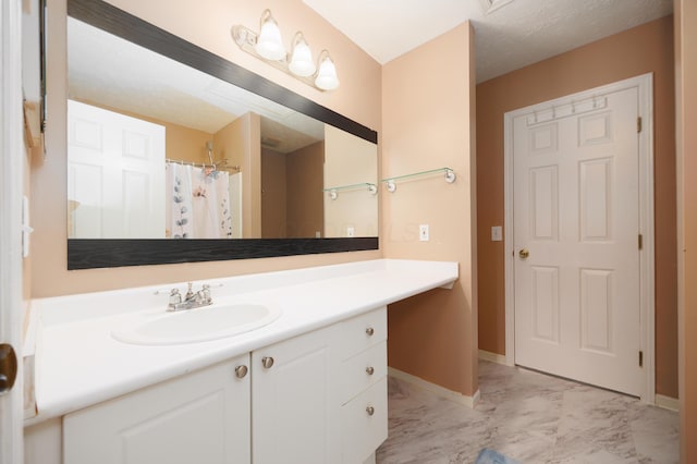 4618 Parrau Dr Unit 72B, Columbus, OH 43228 - full bath featuring marble look tile flooring, vanity, baseboards, and curtained shower