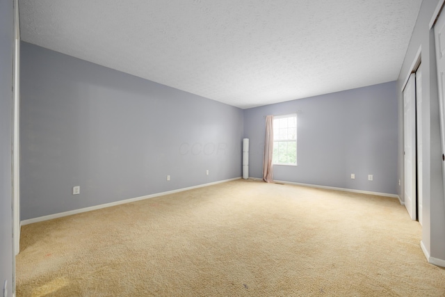 4618 Parrau Dr Unit 72B, Columbus, OH 43228 - unfurnished bedroom with carpet, a textured ceiling, and baseboards