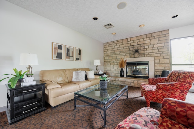 4618 Parrau Dr Unit 72B, Columbus, OH 43228 - living area with a textured ceiling and a fireplace
