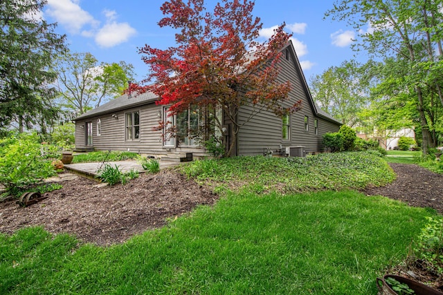 251 Longbranch Dr, Dublin, OH 43017 - view of side of home with cooling unit and a chimney