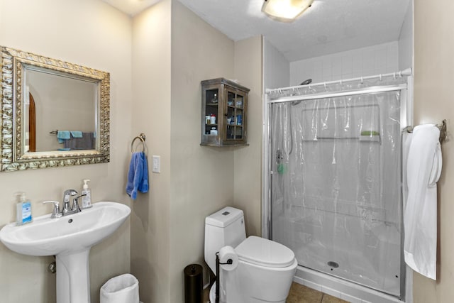 251 Longbranch Dr, Dublin, OH 43017 - bathroom featuring a shower stall, toilet, and tile patterned floors